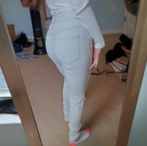 Grayish white ripped jeans